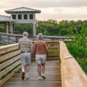 older couple walking on dock